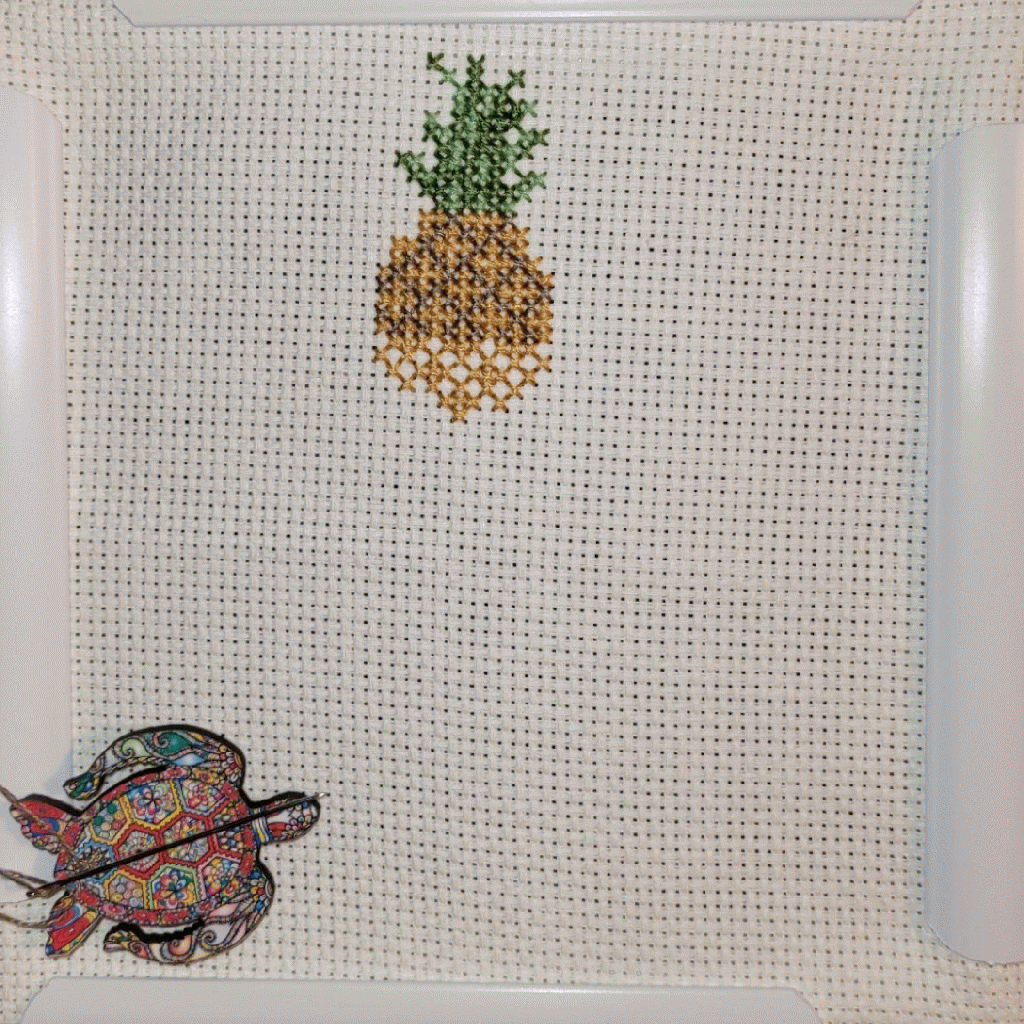 Gif of work in progress - Christmas tree ornament with a pineapple on top and two rows of apples
