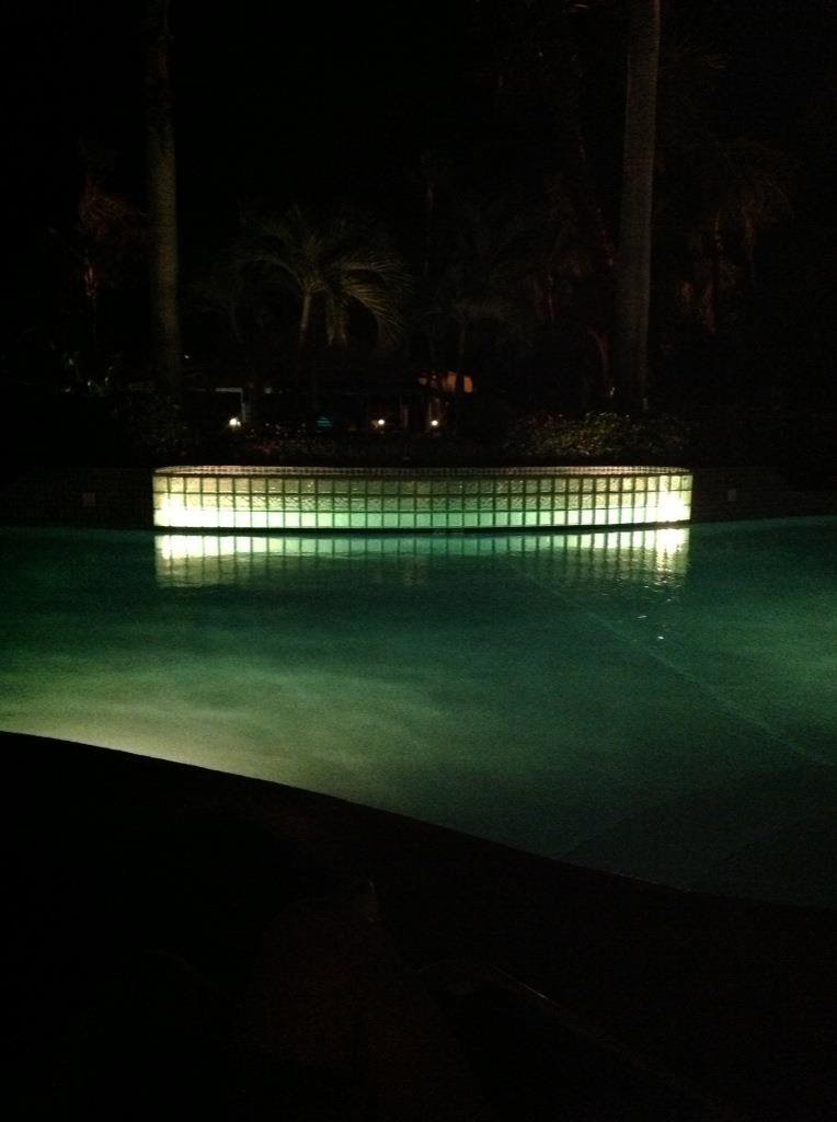 Shot of a hotel pool at night