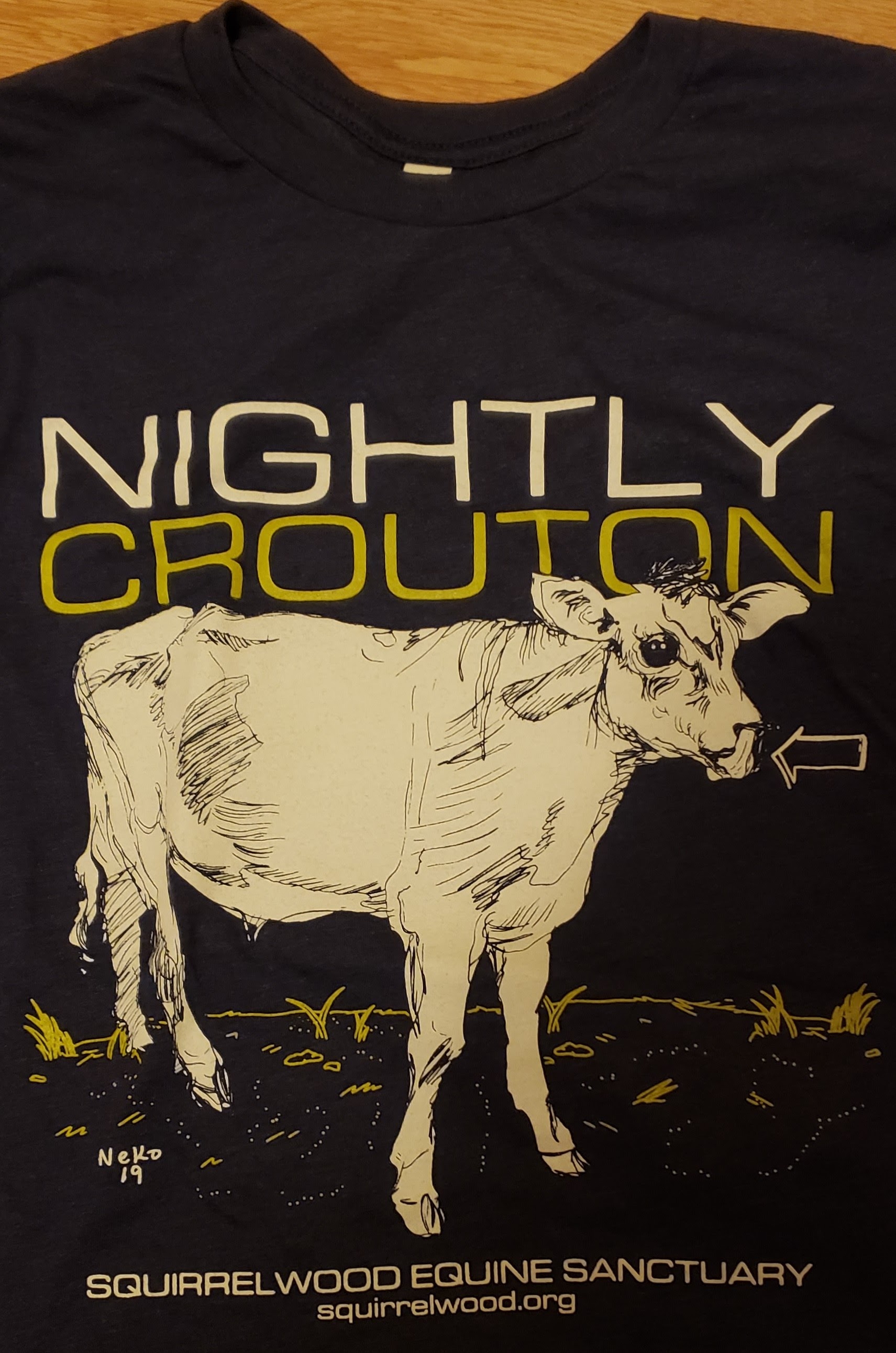 Nightly Crouton t-shirt with an illustration of a cow on it